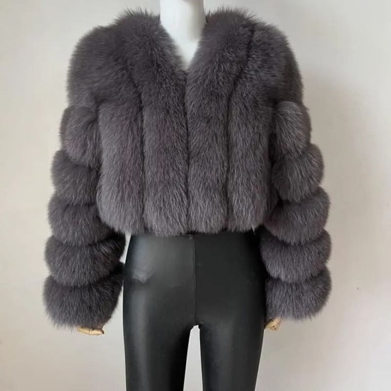 Plush gray fur coat with puffy sleeves and a cropped length.