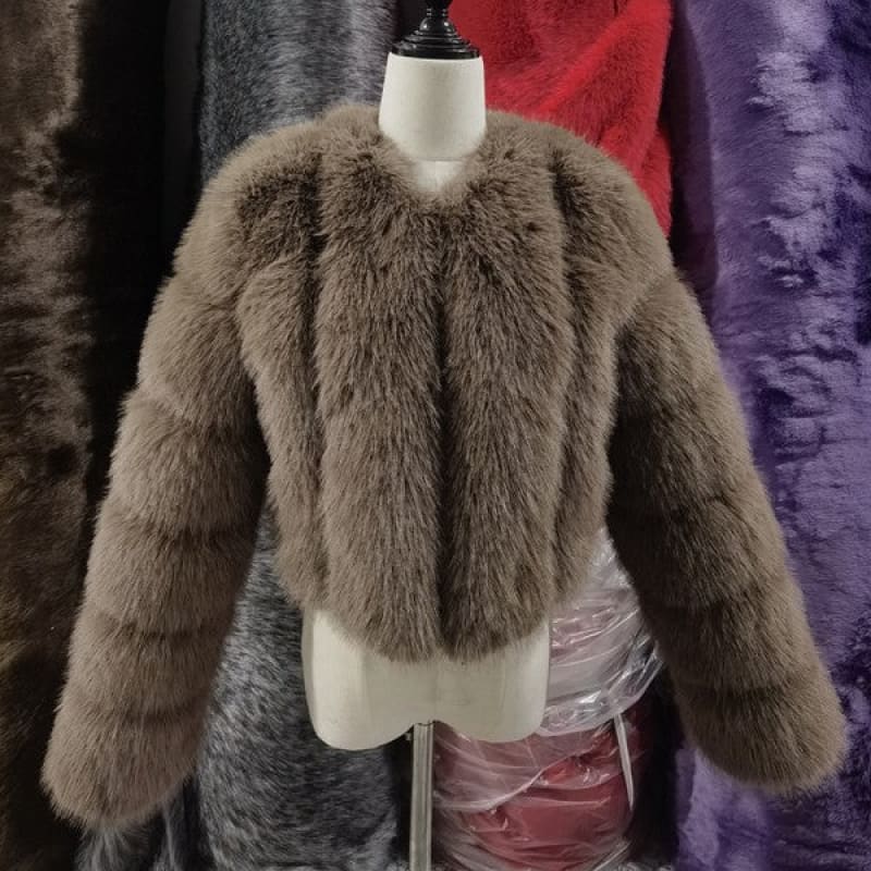 Plush brown faux fur jacket displayed on a mannequin torso.