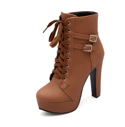 Brown leather high-heeled ankle boot with laces and buckle straps.