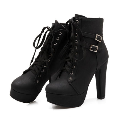 Black high-heeled ankle boots with laces and buckle straps.