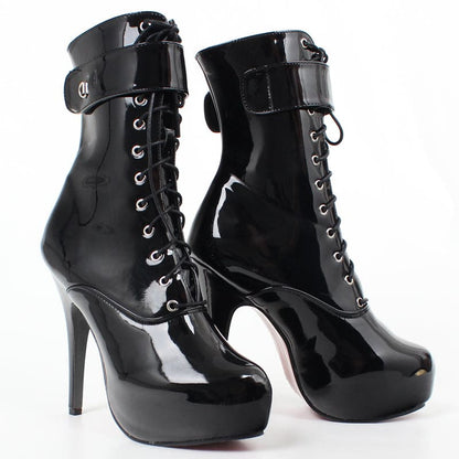 Pair of shiny black high-heeled platform ankle boots with lace-up fronts.