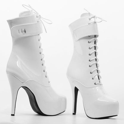 White high-heeled platform ankle boots with laces.