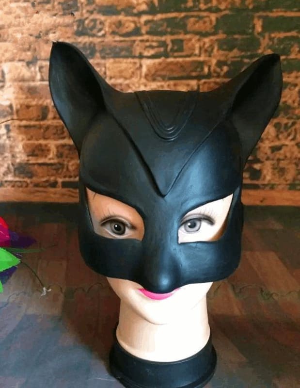 Black cat-themed mask with pointed ears and eye openings.