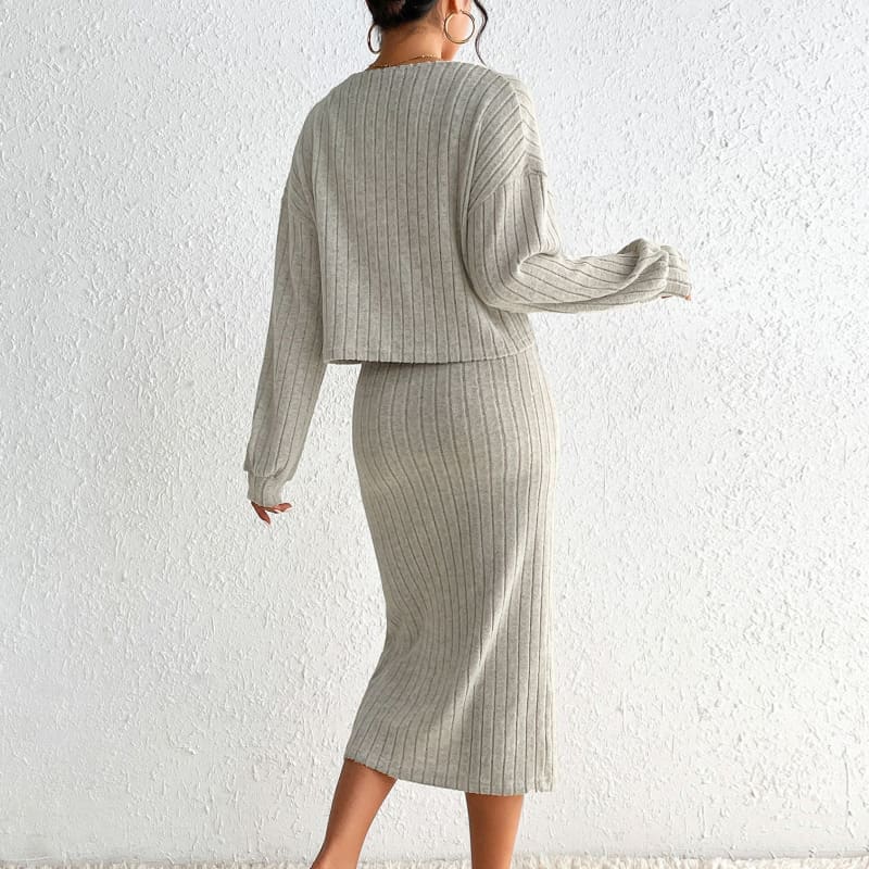 Ribbed knit sweater and skirt set in light gray.