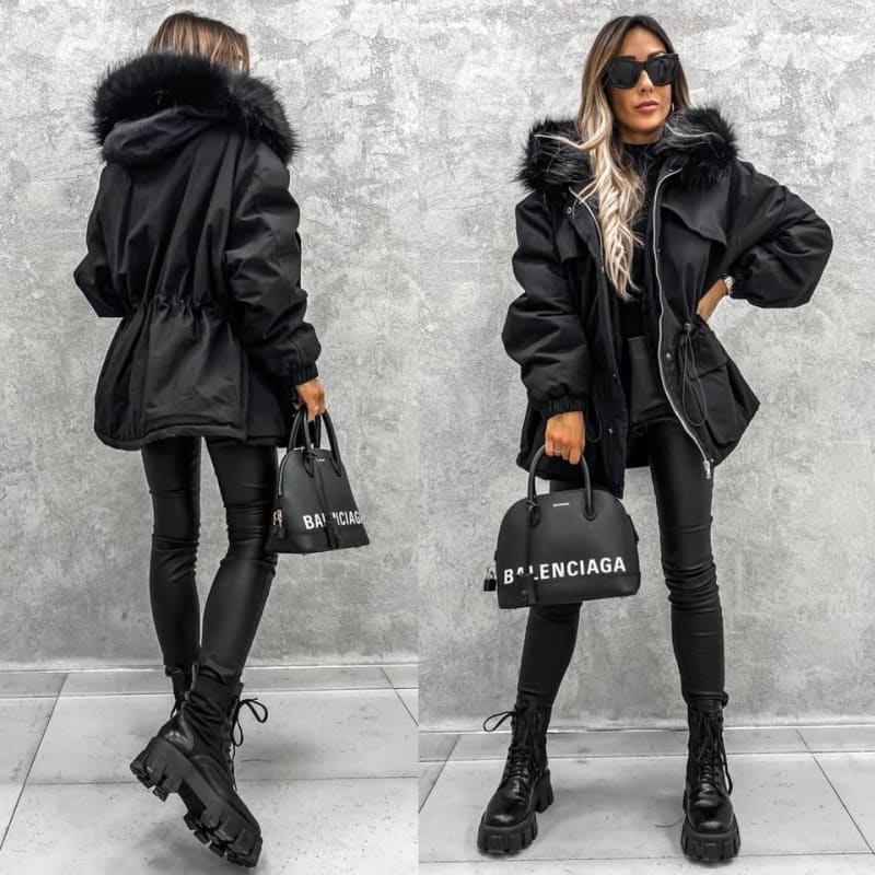 Black winter coat with fur-trimmed hood and cinched waist.