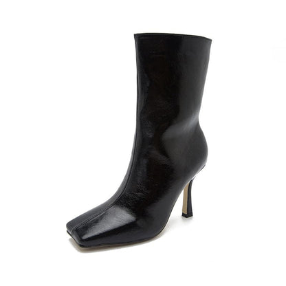 Black leather ankle boot with a square toe and stiletto heel.