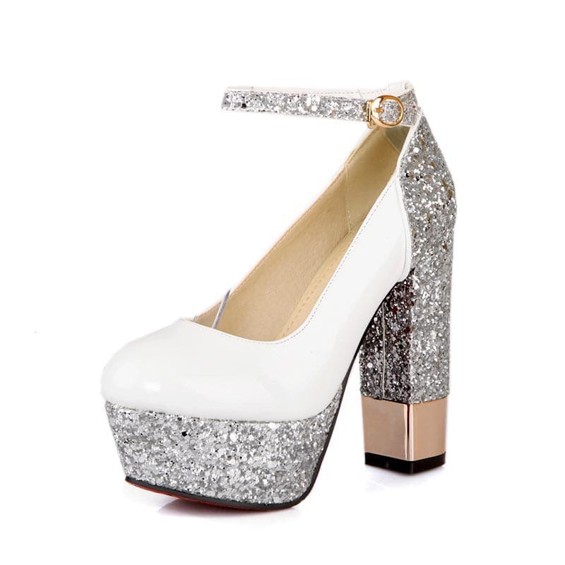 High-heeled platform shoe with white upper and silver glitter accents.