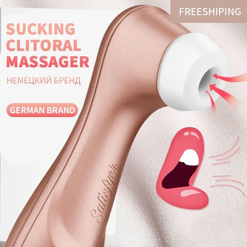 A rose gold-colored personal massager device with a white tip and suction feature.