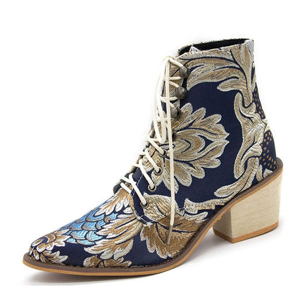 Ornate ankle boot with floral embroidery and a chunky heel.