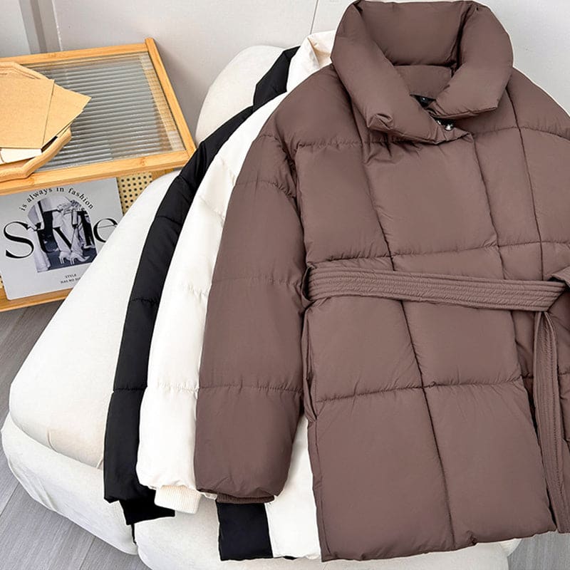 Brown puffy winter coat with a belt and high collar.