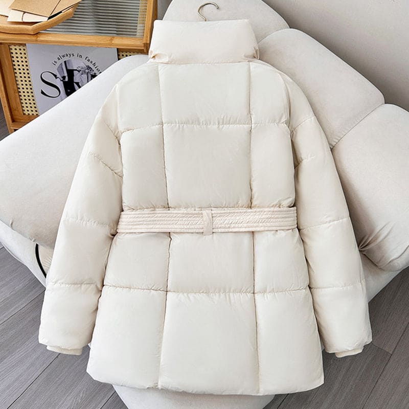 White quilted puffer jacket with a belt.