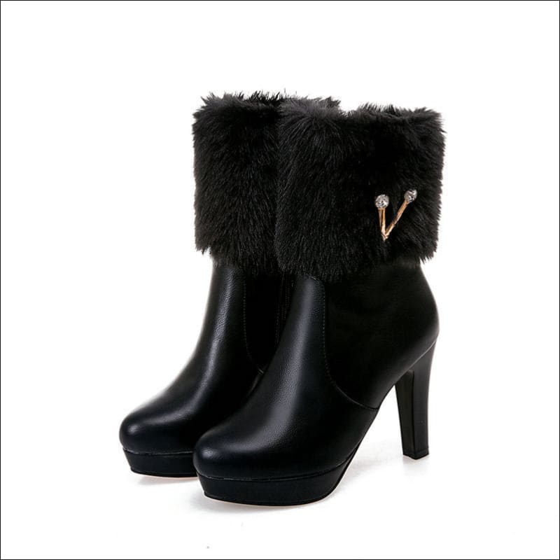 Black chunky heel ankle boots with fur trim for stylish ladies winter short snow looks.