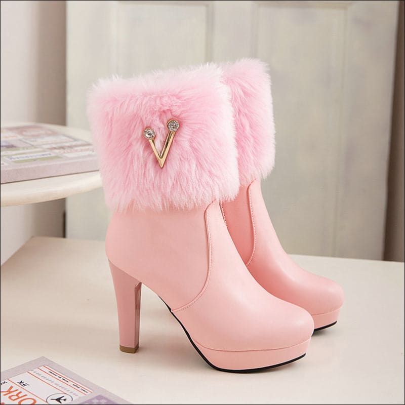 Pink high-heeled ankle boots with furry trim, perfect for ladies winter short style.