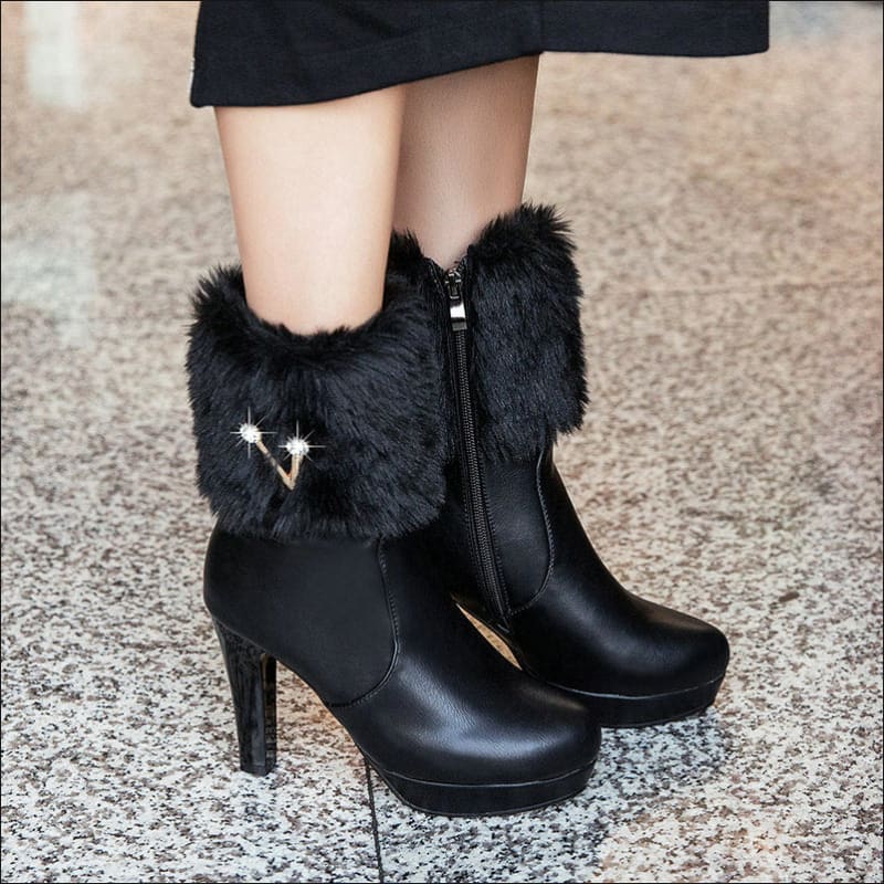 Black high-heeled boots with furry trim, perfect ladies winter short snow booties.