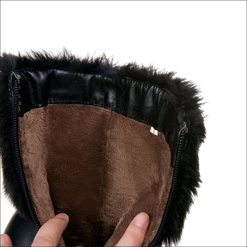 Black fur-lined boot with brown interior, perfect ladies winter short snow chunky heel style.