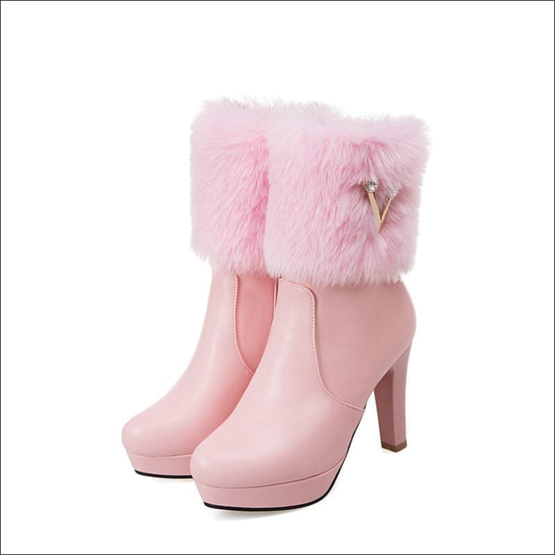 Pink high-heeled ankle boots with furry trim, perfect ladies winter short snow style.