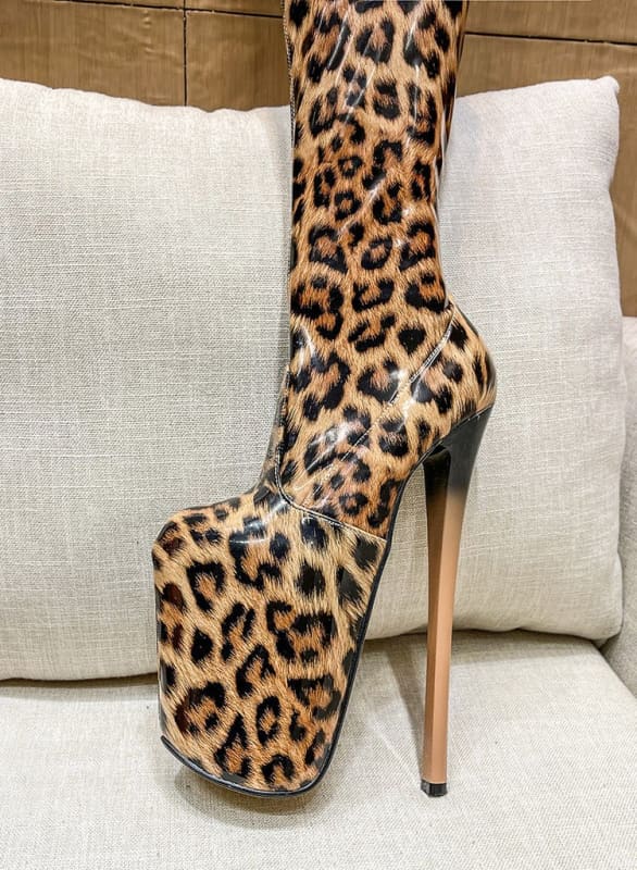 Extremely high platform stiletto boot with leopard print pattern.