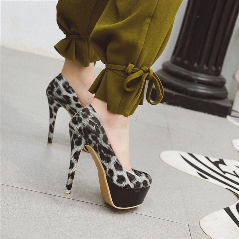 Leopard-print high heel platform shoe with a very tall stiletto heel.