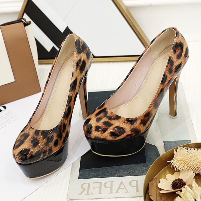 Pair of high-heeled leopard print platform pumps.