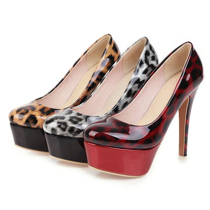 Three high-heeled platform shoes in different animal print and patent leather designs.