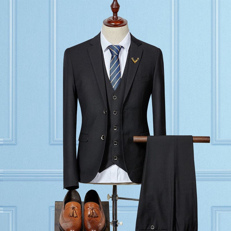 Three-piece charcoal gray suit with a blue striped tie displayed on a mannequin.