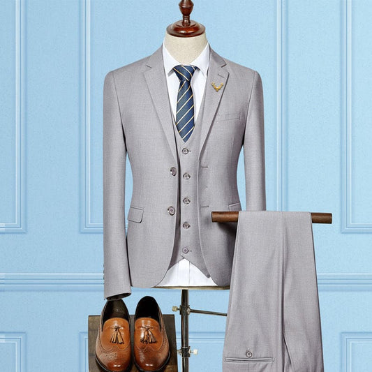 Light gray three-piece suit with a blue striped tie displayed on a mannequin.