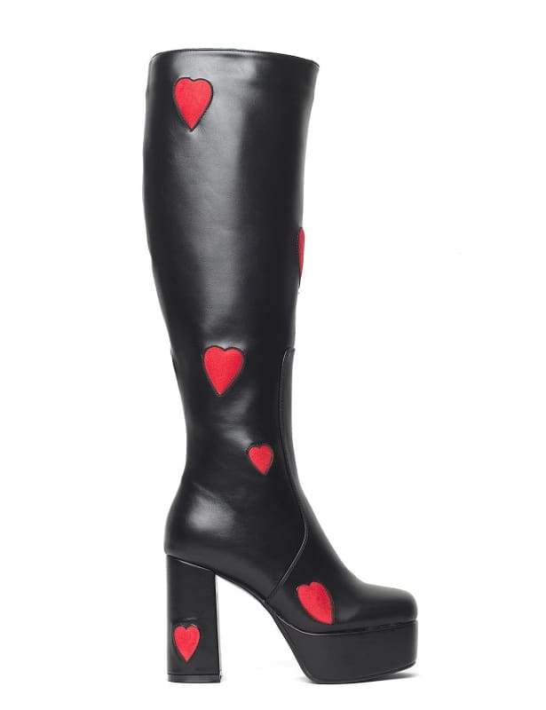 Black knee-high platform boot with red heart designs.