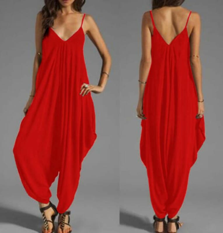 Bright red loose-fitting jumpsuit with spaghetti straps and a harem pant style bottom.