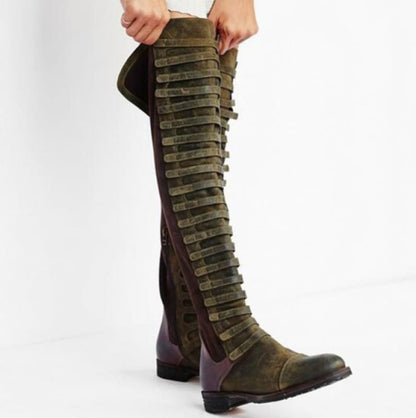 Tall olive green leather boot with multiple buckled straps running up the length.