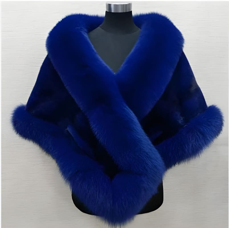 Vibrant blue fur shawl or wrap with a plush, luxurious appearance.