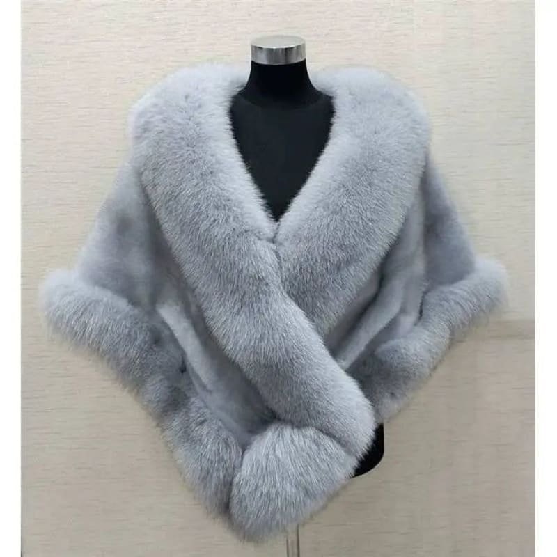 Luxurious gray fur wrap with plush trim and a V-neckline.