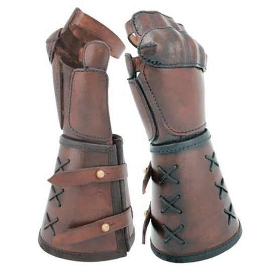 Pair of brown leather gauntlets or armored gloves with lacing and straps.