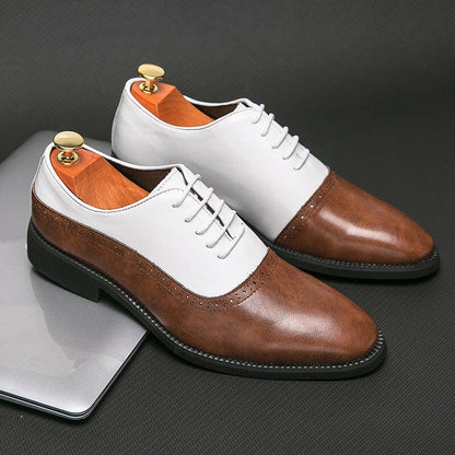 Two-tone leather oxford dress shoes with brown toes and heels and white uppers.