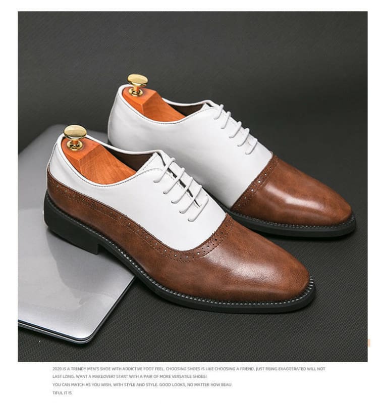 Two-tone leather oxford shoes with white uppers and brown toe caps.