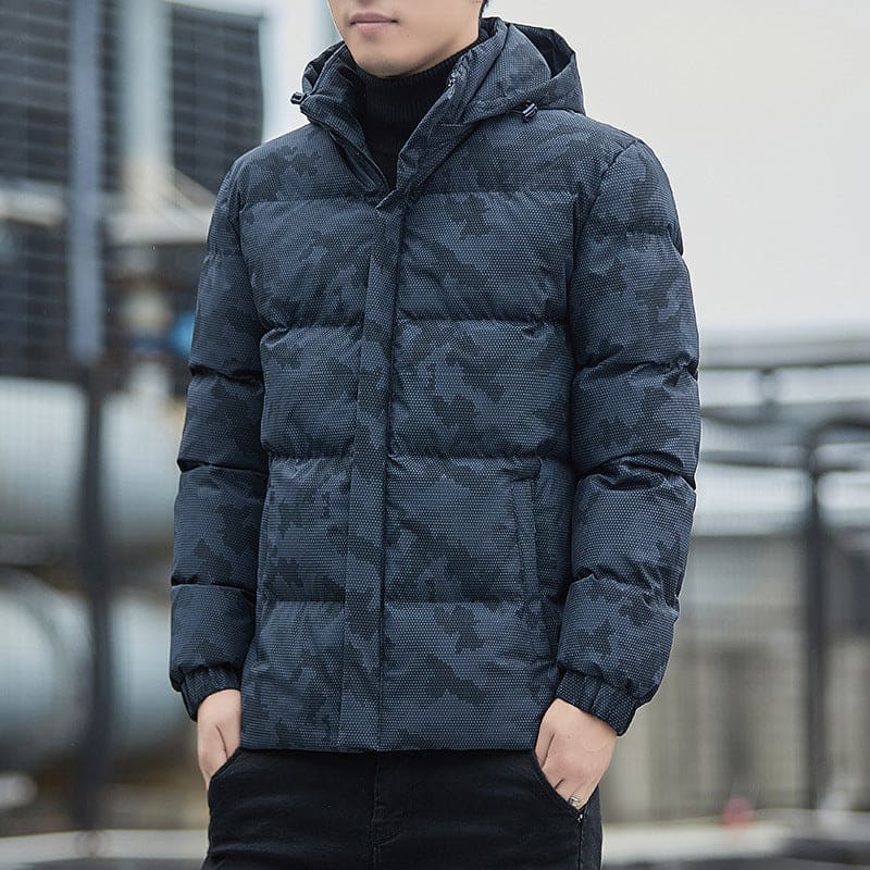 Puffy gray winter jacket with a hood and camouflage-like pattern.