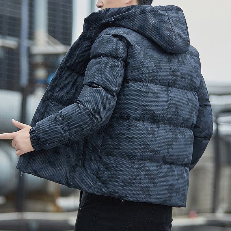 Puffy blue-gray winter jacket with a camouflage-like pattern and hood.