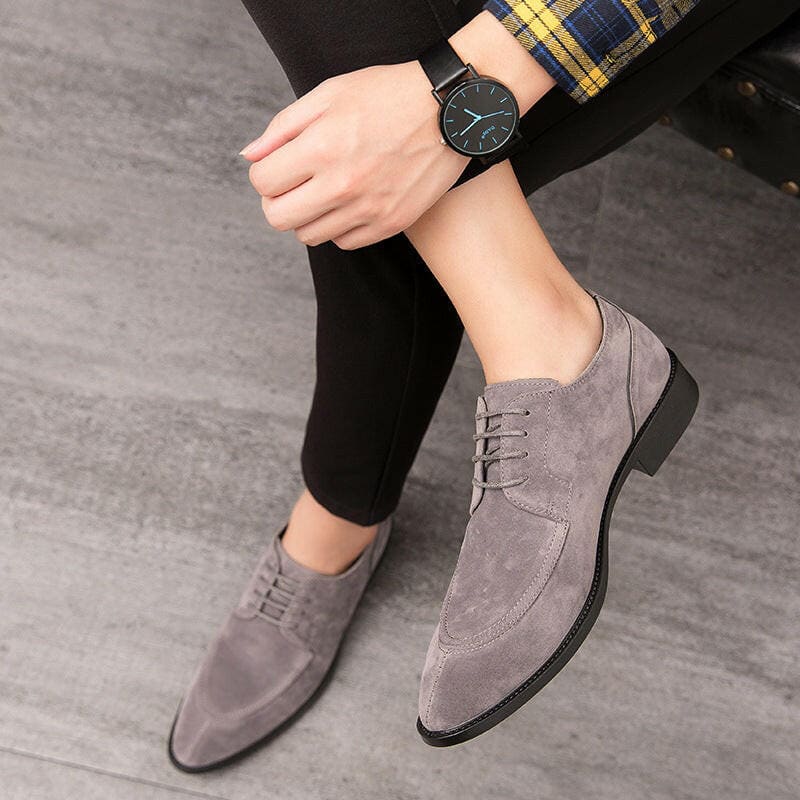 Gray suede oxford shoes with laces.