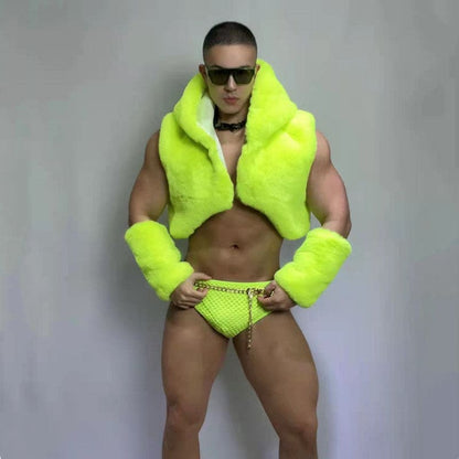 Muscular person wearing neon yellow fur jacket and matching bikini bottom with sunglasses.