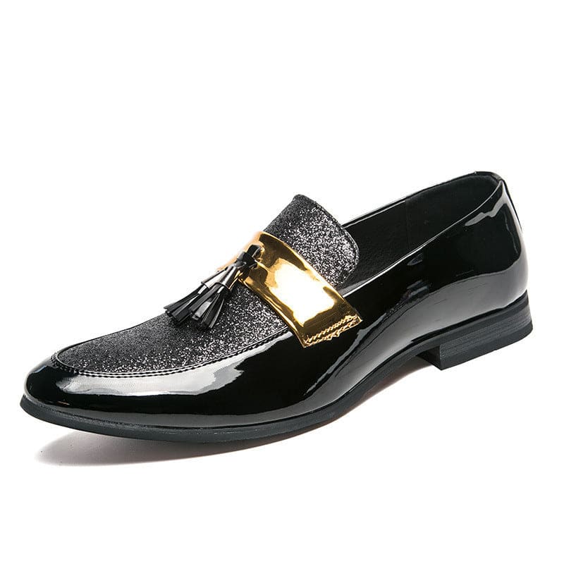 Glossy black dress shoe with a glittery top, gold accent, and tassel detail.