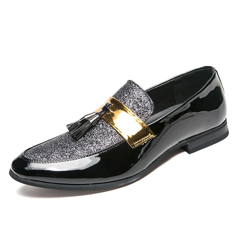 Stylish men’s dress loafer with glittery silver accents, patent leather, and gold metallic band with tassels.