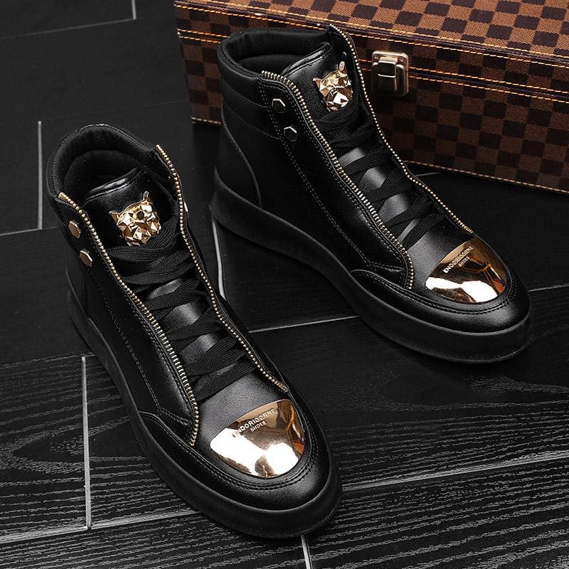 Pair of black high-top sneakers with gold metallic toe caps and decorative tiger emblems.