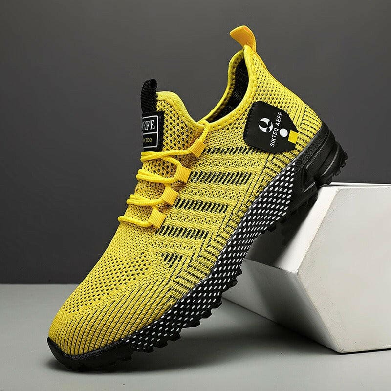 Bright yellow athletic sneaker with black accents and a mesh upper design.