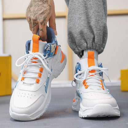 Pair of white, blue, and orange athletic sneakers with chunky soles.