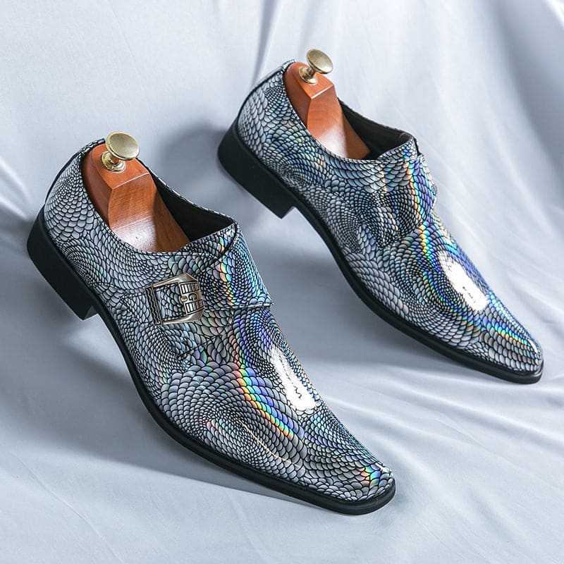 Pair of shiny, silver dress shoes with a holographic snakeskin-like pattern.