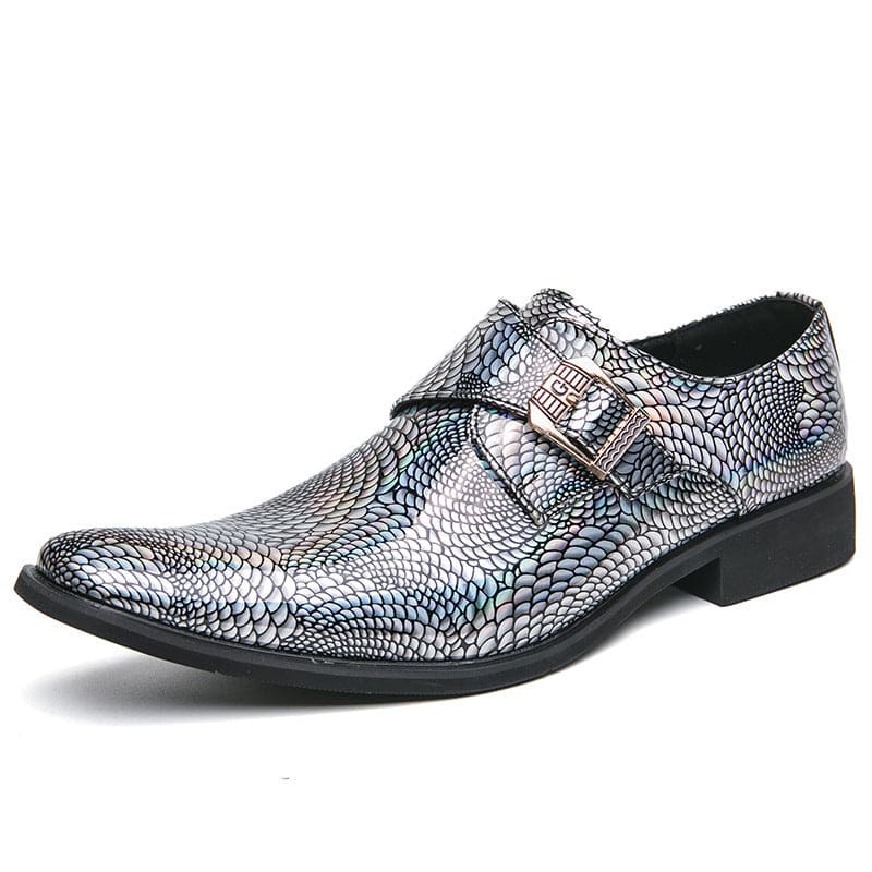 Metallic silver dress shoe with a snakeskin-like pattern and a buckle strap.