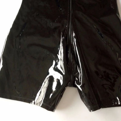 Shiny black latex or vinyl pants with a split at the bottom of the leg.