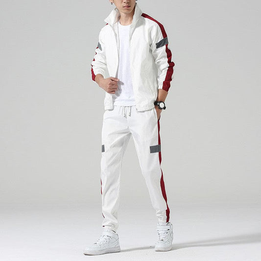 White tracksuit with red and gray stripes on the jacket and pants.