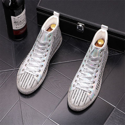 Pair of white high-top sneakers with silver metallic accents and striped pattern.