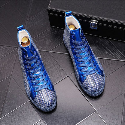 Pair of blue high-top sneakers with metallic silver detailing and blue laces.