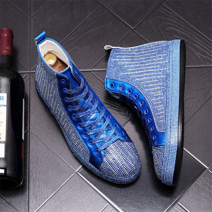 Pair of blue high-top sneakers with a textured knit fabric upper and bright blue laces.